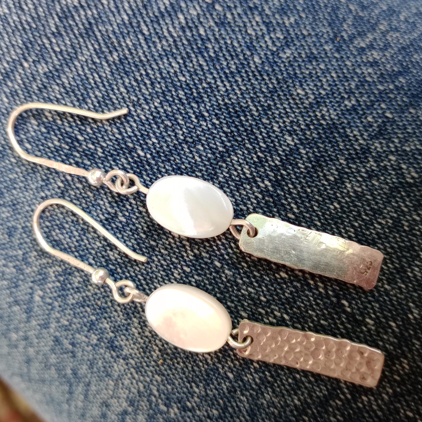 Hand hammered sterling silver earrings with mother of pearl