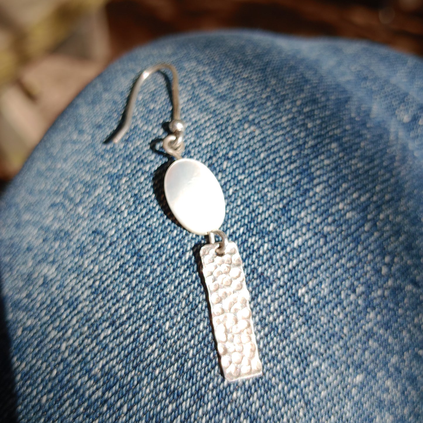 Hand hammered sterling silver earrings with mother of pearl